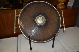 Cambria Charger Shield Shape on a Stand