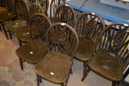Twelve Wheel Back Dining Chairs