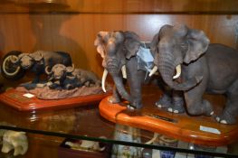 Pair of Pottery Elephants and Bison on Wood Plinths
