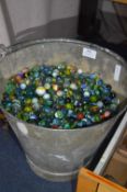 Galvanized Bucket Containing a Large Quantity of Marbles