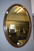 Oval Oak Framed Bevelled Edge Wall Mirror