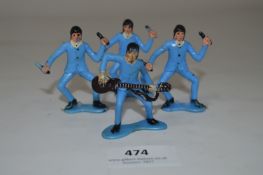 Four Plastic Beatles Figures