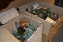 Two Boxes Containing a Large Amount of Aqua Green and Brown Glass Bottles