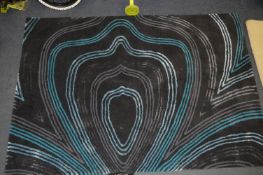 *Blue Curly Strip on Black Rug 120x180cm