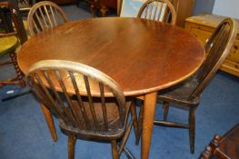 Oak Circular Occasional Table with a Set of Four Windsor Stickback Dining Chairs