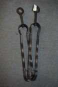 Two Black Metal Fireside Tongs