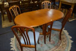 Teak Drop Leaf Dining Table and Four Slatback Dining Chairs