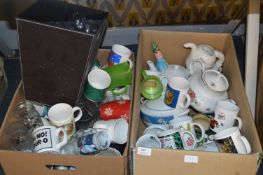 Two Boxes Containing a Large Quantity of Mugs, Teapots, Waste Bin, Drinking Glassware, etc.