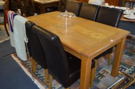 Oak and Maple Extending Dining Table with Six Brown Faux Leather Dining Chairs