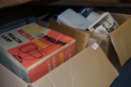 Two Boxes Containing Casserole Pot, Toaster, Health Lamp, VHS/DVD Recorder, etc.