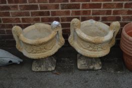 *Pair of Reconstituted Limestone Garden Urns on Plinths