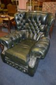Green Leather Buttoned Winged Armchair