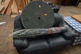 *Blue Leather Two Seat Sofa, Circular Patio Table and a Green Umbrella