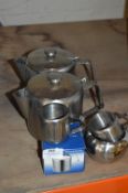 Two Large Teapots, Three Cream Jugs and a Stainless Steel Sugar Basin