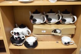 Four Six Cup Teapots and Sixteen Matching Tea Cups & Saucers (Black & White)