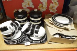 Two Black & White Storage Jars, Two Trays and Ten Cups & Saucers