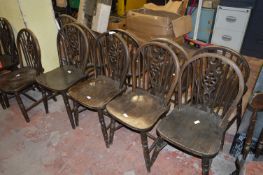 Twelve Wheel Back Dining Chairs