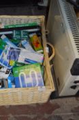 Wicker Basket Containing Assorted Light Bulbs and a Convector Heater