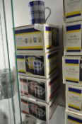 Two Boxes of Black & Red and Two Boxes of Blue & Yellow Scotty Mugs