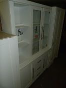 *White Display Unit Enclosed by Glazed Door over Drawers and Cupboards