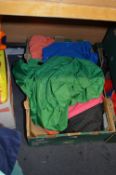 Box Containing Seven Pieces of Assorted Cycling Clothing