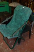 Green Plastic Table and a Folding Garden Chair