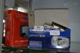 Digital Camera and a Olympus 11180 Camera