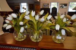 Three Artificial Flowers in Glass Bowls