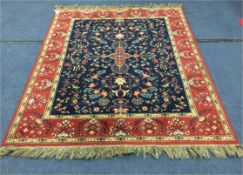 Blue and Red Floral Patterned Rug 6ft 7in x 4ft 5in