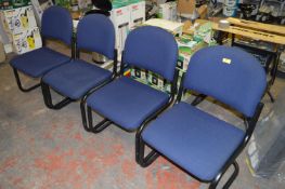 Four Blue Upholstered Office Chairs