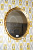 Oval Gilt Framed Bevelled Edge Wall Mirror