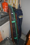 Approximately 10 Assorted Fishing Rods , Umbrellas in Bags, etc.