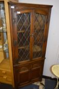 Oak Corner Display Cabinet with Lead Glass Doors