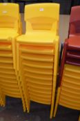 *Twelve Stackable Yellow Plastic Children's Chairs
