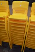 *Twelve Stackable Yellow Plastic Children's Chairs