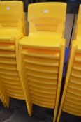 *Twelve Stackable Yellow Plastic Children's Chairs