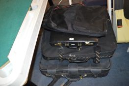 Three Suitcases and a Combination Attache Case