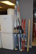 Two Pairs of Adult Skis and Childs Pair with Boots