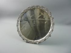 A CIRCULAR SILVER SALVER having an intricate beadwork, latticework and floral border and centre