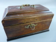 A GEORGIAN MAHOGANY OBLONG TOP TEA CADDY with metal top handle, interior lidded tea compartment with