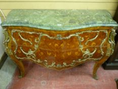 A LOUIS XVI STYLE BOMBE COMMODE CHEST with serpentine green marble top over two Kingwood marquetry