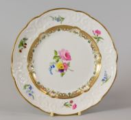 A SWANSEA PORCELAIN DESSERT PLATE with lobed rim and having a moulded border with C-scrolls,