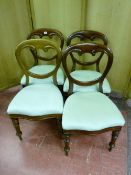 A SET OF FOUR LATE VICTORIAN MAHOGANY BALLOON BACK STYLE CHAIRS with serpentine fronts and reeded