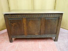 A POLISHED BLANKET CHEST with three fielded front panels, 107 cms wide