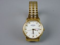 A GENT'S YELLOW METAL ENCASED CIRCULAR DIAL ROTARY QUARTZ CALENDAR WRISTWATCH with expanding