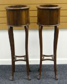 A PAIR OF JARDINIERE STANDS of cylindrical form on bow supports with lower tiers