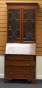 AN EDWARDIAN INLAID MAHOGANY BUREAU BOOKCASE (distressed)