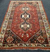 100% WOOL PILE RED GROUND IRANIAN RUG 245 x 165cms