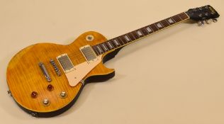 A VINTAGE ELECTRIC GUITAR in light wood with dark wood contrast, serial number I06101330, 100cms