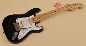 A FENDER STRATOCASTER ELECTRIC GUITAR original contour body, black with white scratchplate, serial